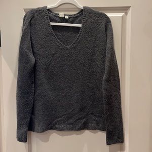 Woman’s dark gray v-neck sweater!